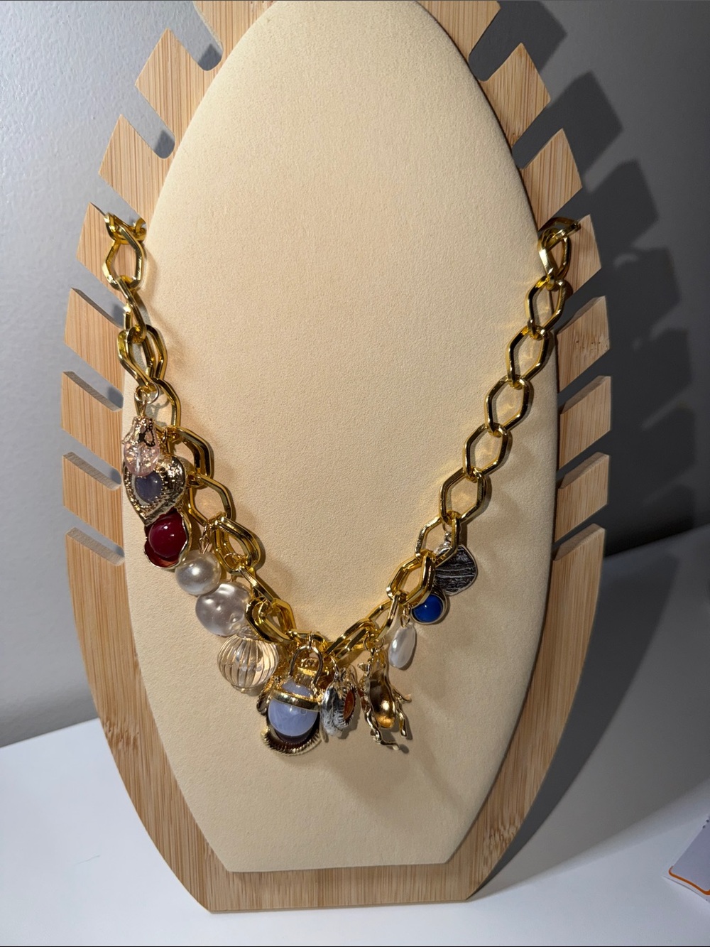 Gold Multi-Charm Chain Necklace with Red, Blue and Pearl Accents
